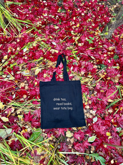 Embroidered cotton tote bag featuring a quote