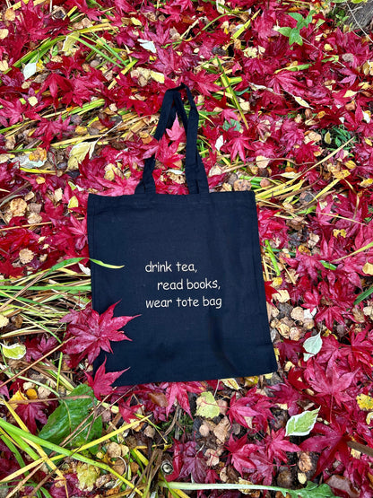 Embroidered cotton tote bag featuring a quote